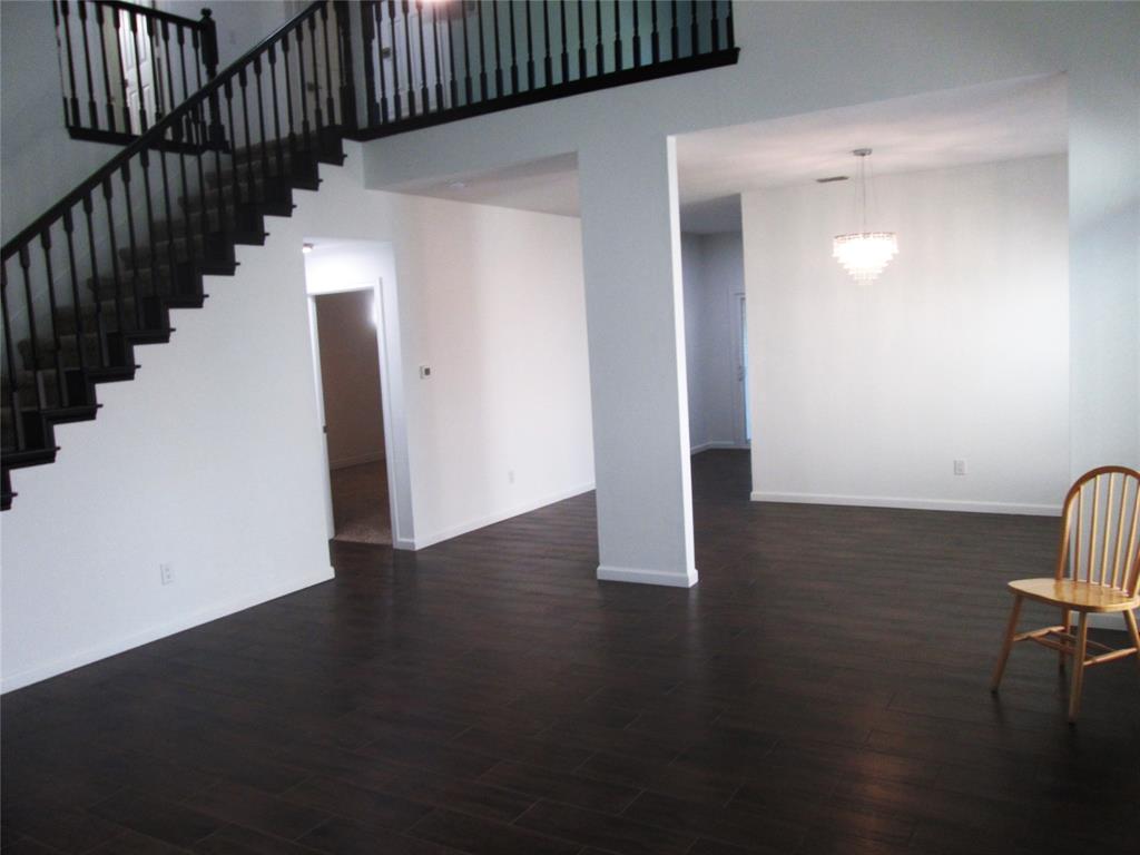 1305 Berkeley Court Plano, TX 75023 - Photo 16 of 34 a view of an entryway with wooden floor