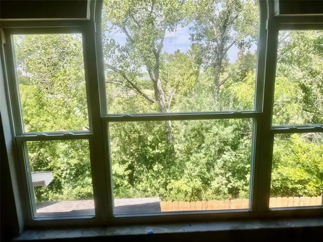 a view of a house with a tree