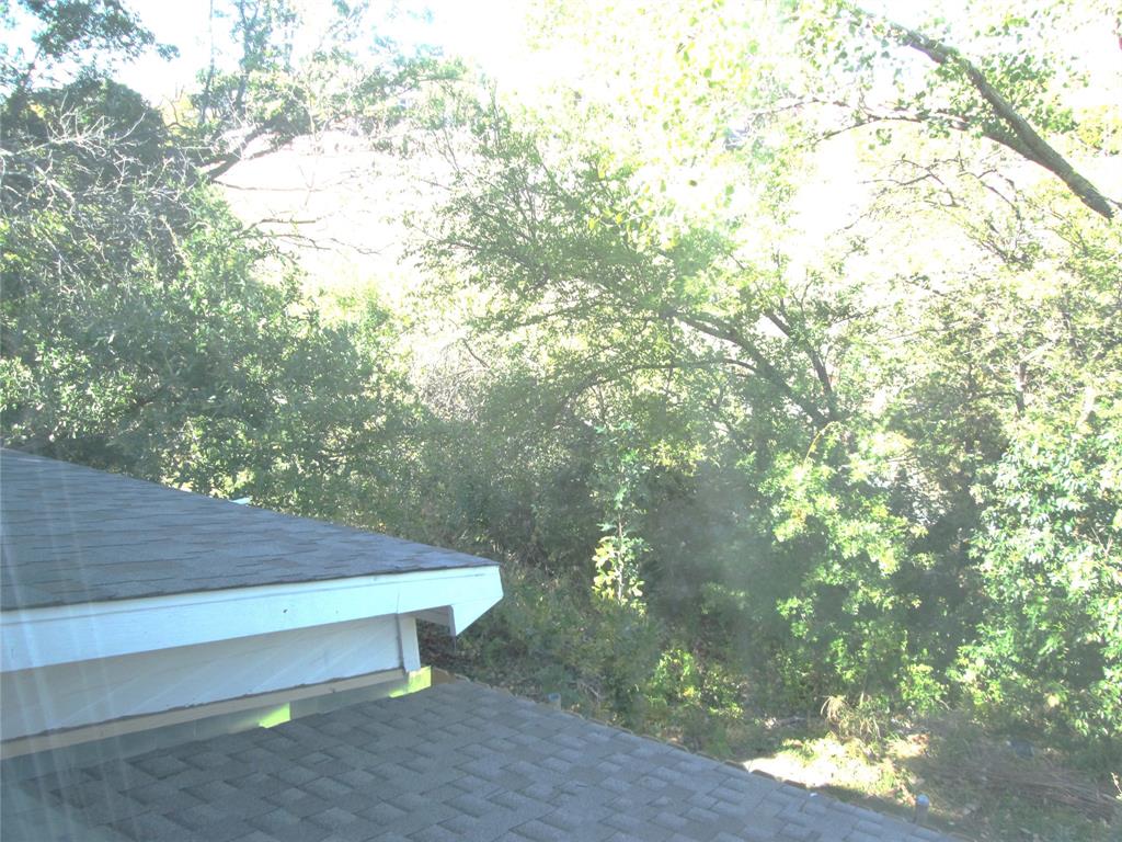 1305 Berkeley Court Plano, TX 75023 - Photo 21 of 34 a view of backyard with tree