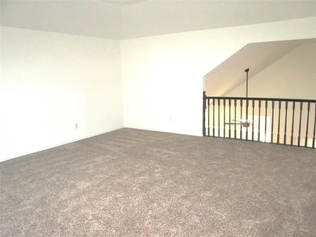 a view of staircase with wooden floor and stairs