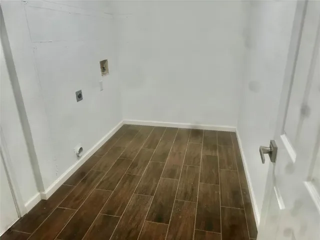 a front view of a house with a yard and a garage