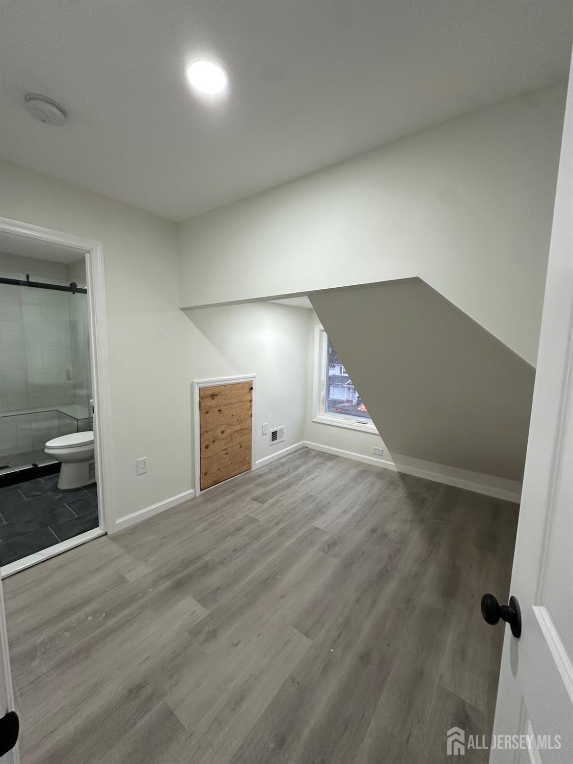112 Fairview Avenue, Unit 2 Middlesex, NJ 08846 - Photo 21 of 29 a view of an empty room and wooden floor