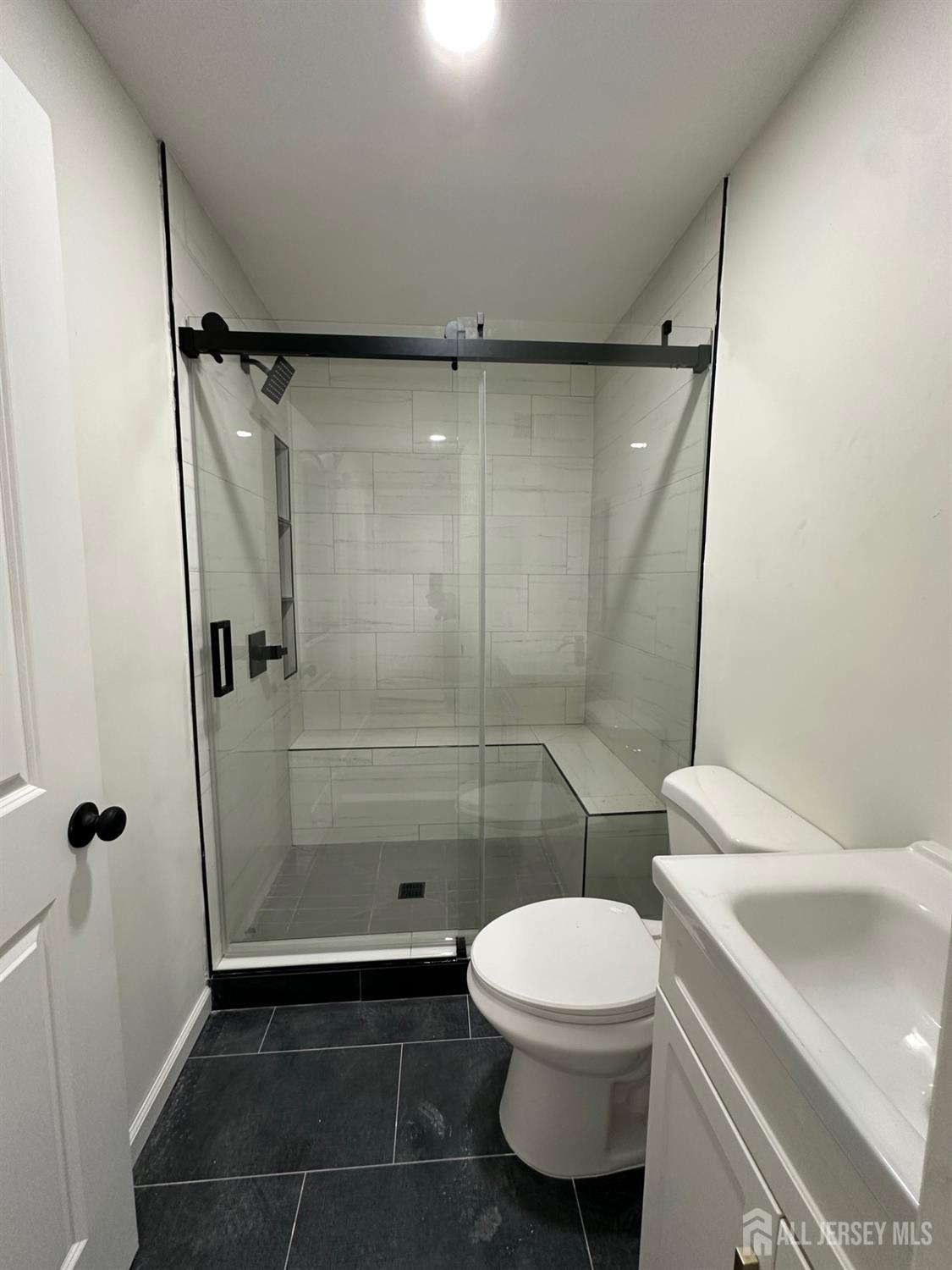 112 Fairview Avenue, Unit 2 Middlesex, NJ 08846 - Photo 23 of 29 a bathroom with a toilet and a shower