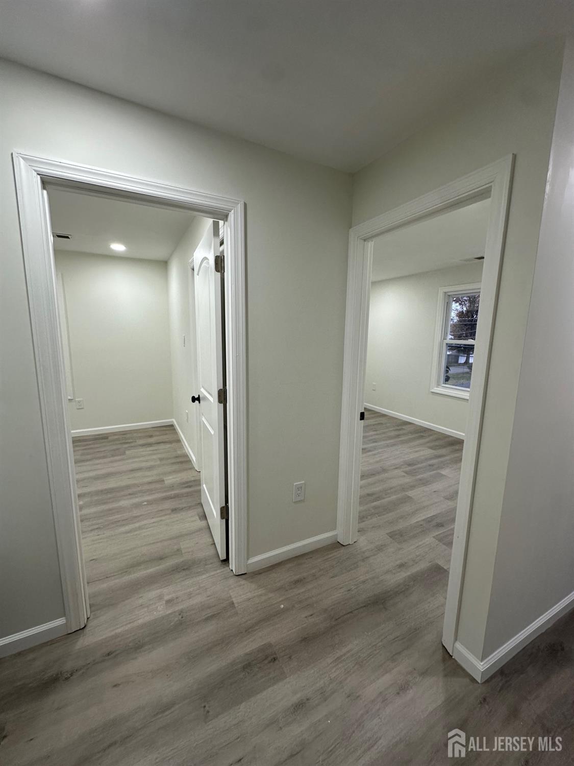 112 Fairview Avenue, Unit 2 Middlesex, NJ 08846 - Photo 26 of 29 a view of a hallway with wooden floor