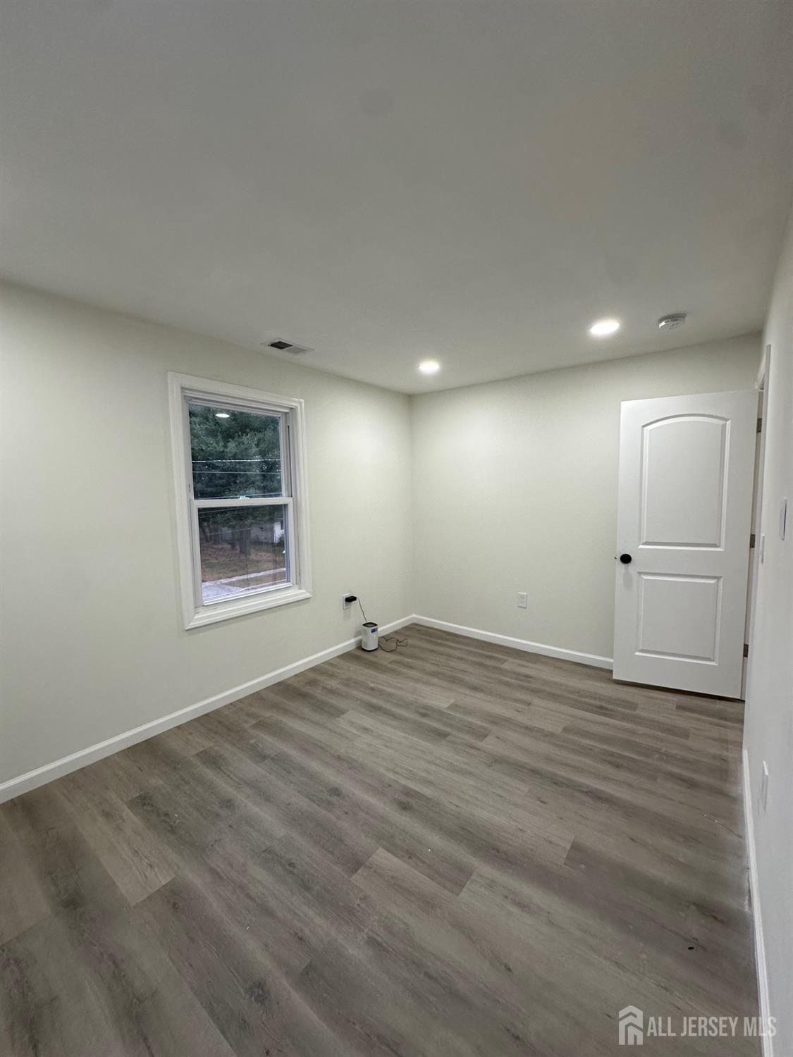 112 Fairview Avenue, Unit 2 Middlesex, NJ 08846 - Photo 29 of 29 an empty room with window and windows