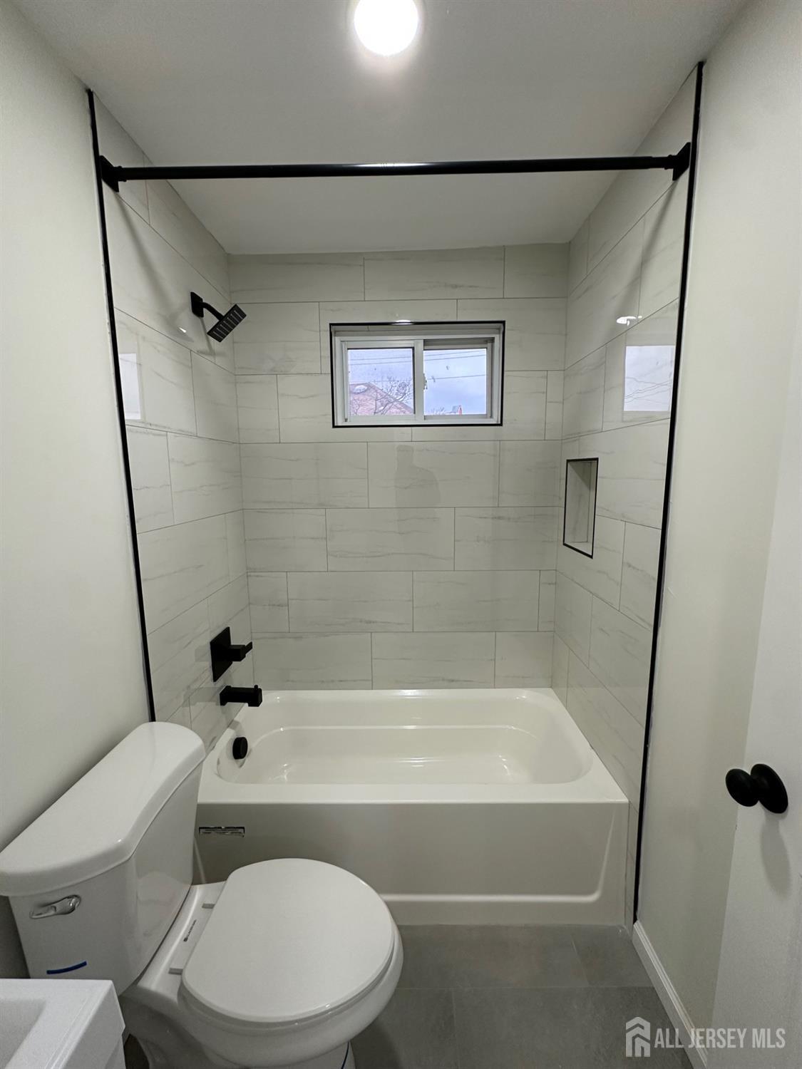 112 Fairview Avenue, Unit 2 Middlesex, NJ 08846 - Photo 10 of 29 a bathroom with a toilet and a bath tub