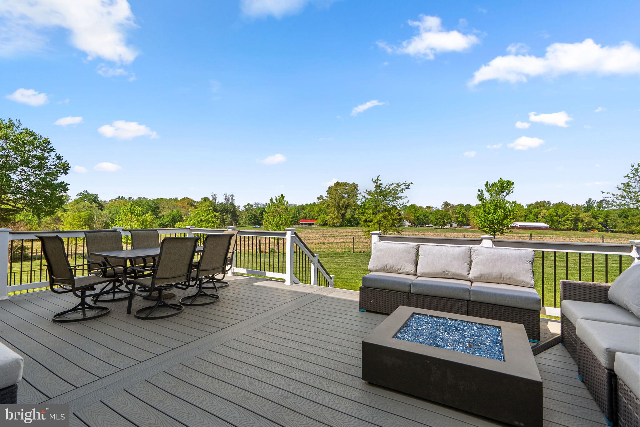 19723 Zion Road Brookeville, MD 20833 - Photo 55 of 67 a view of couch on wooden floor with a lake view