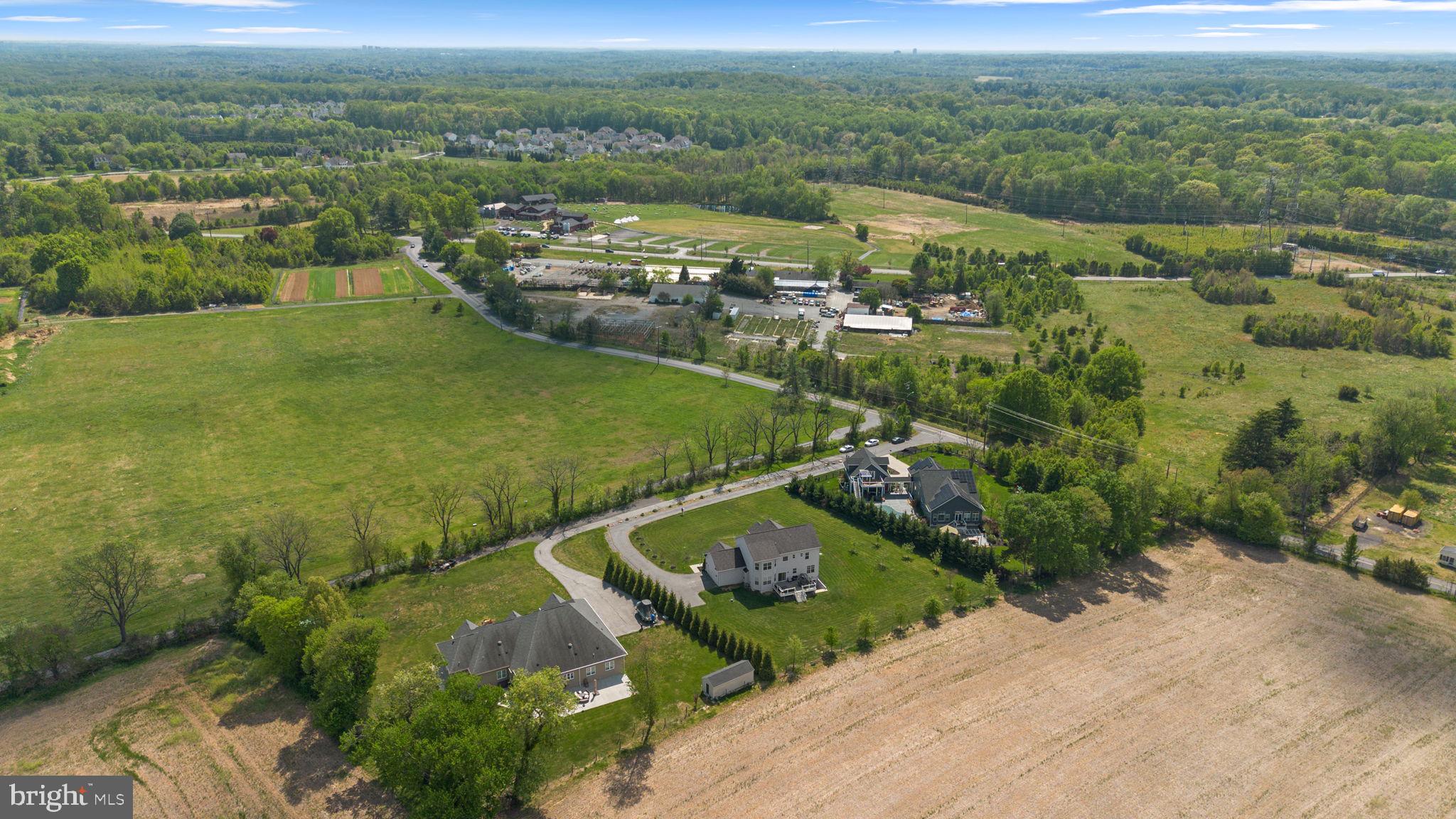 19723 Zion Road Brookeville, MD 20833 - Photo 63 of 67 an aerial view of residential houses with outdoor space and trees