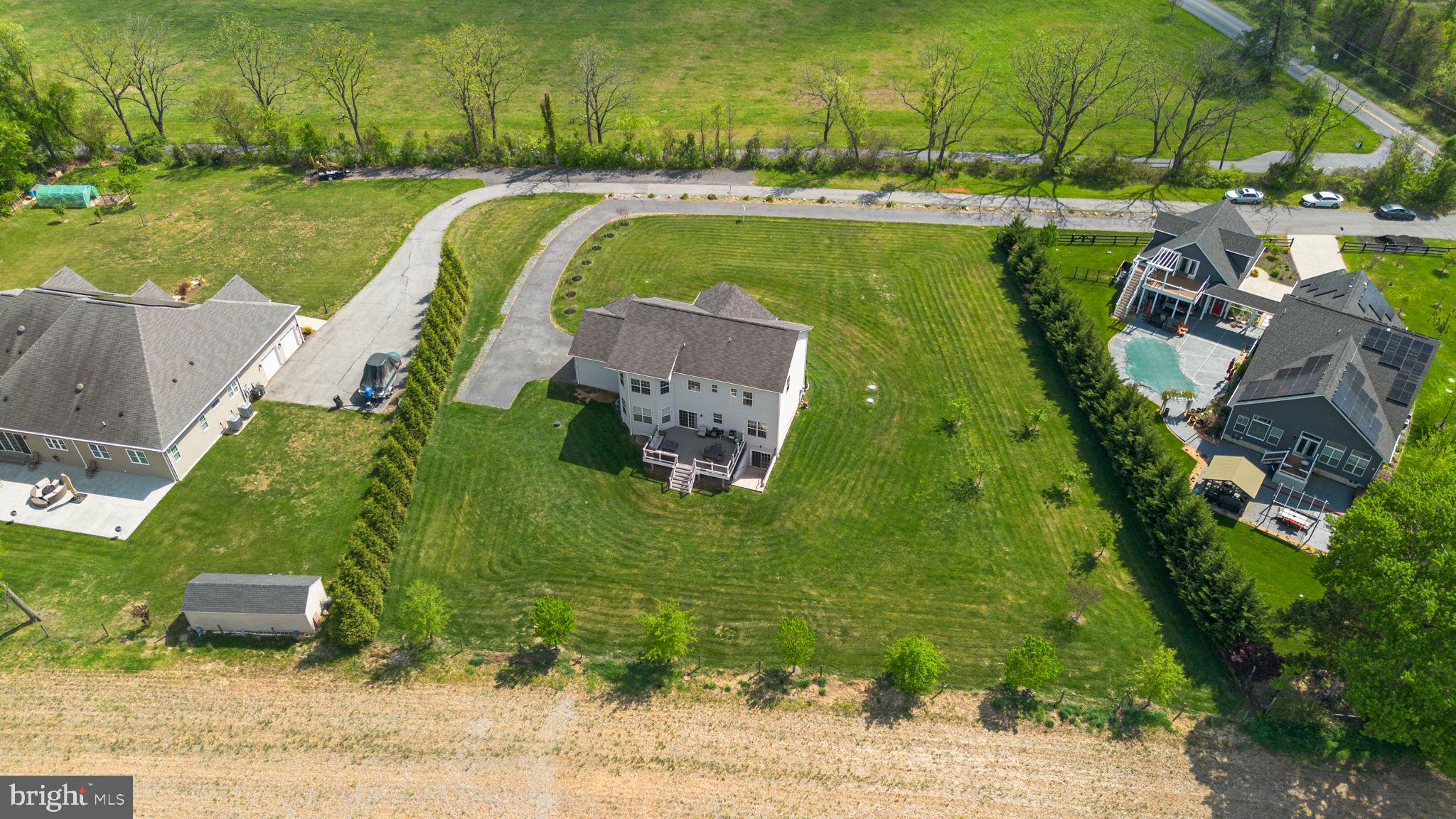 19723 Zion Road Brookeville, MD 20833 - Photo 8 of 67 an aerial view of a house with a swimming pool and outdoor space