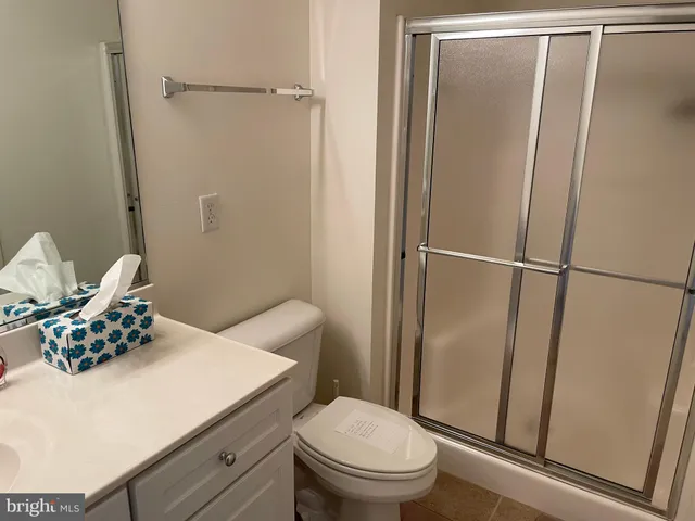 a bedroom with a bed and lamp