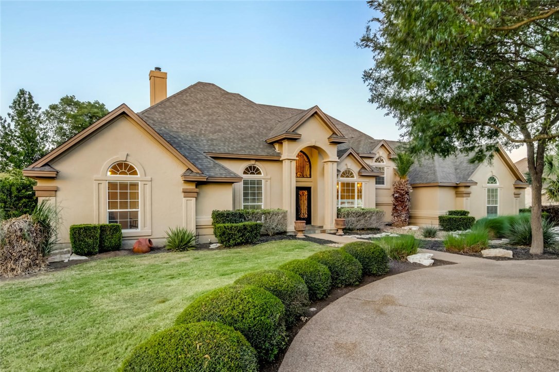 102 Rustic Cedar Trail Georgetown, TX 78633 - Photo 1 of 1 a front view of a house with a yard and garage