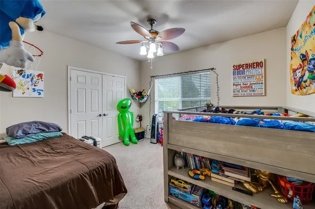 a work room with furniture and a potted plant