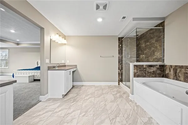 a bathroom with a bathtub and a sink