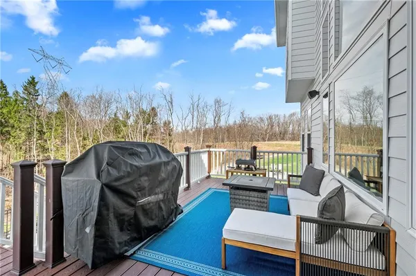 a view of balcony with couches and city view