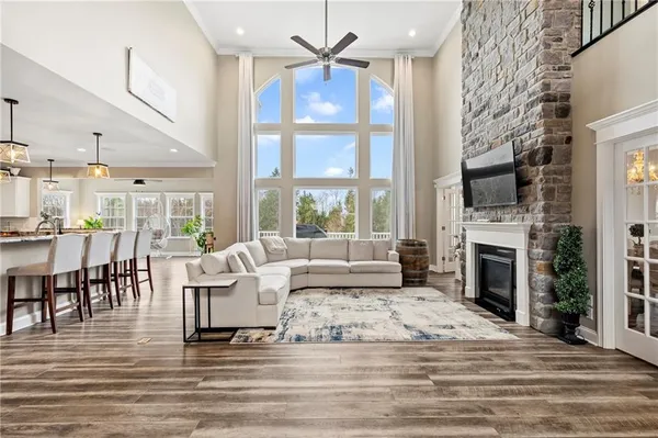 a living room with fireplace furniture and a fireplace