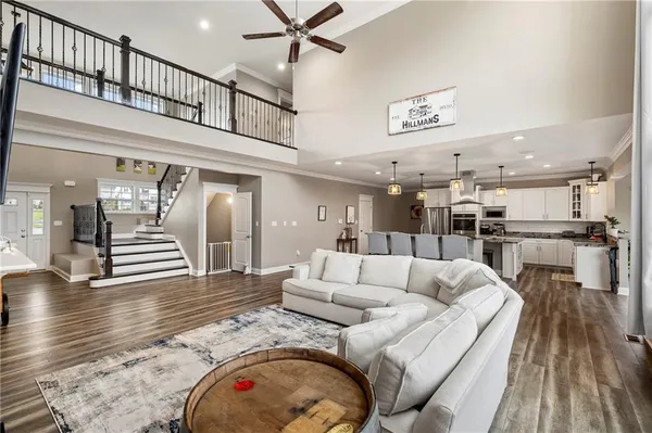 a living room with furniture and kitchen view