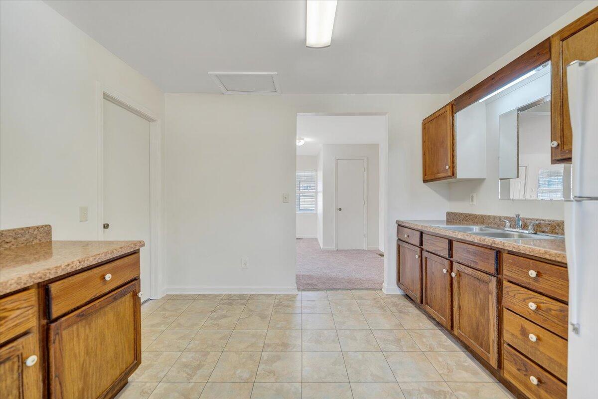 5549 Hollins Road Roanoke, VA 24019 - Photo 16 of 48 a bathroom with a sink a vanity and mirror