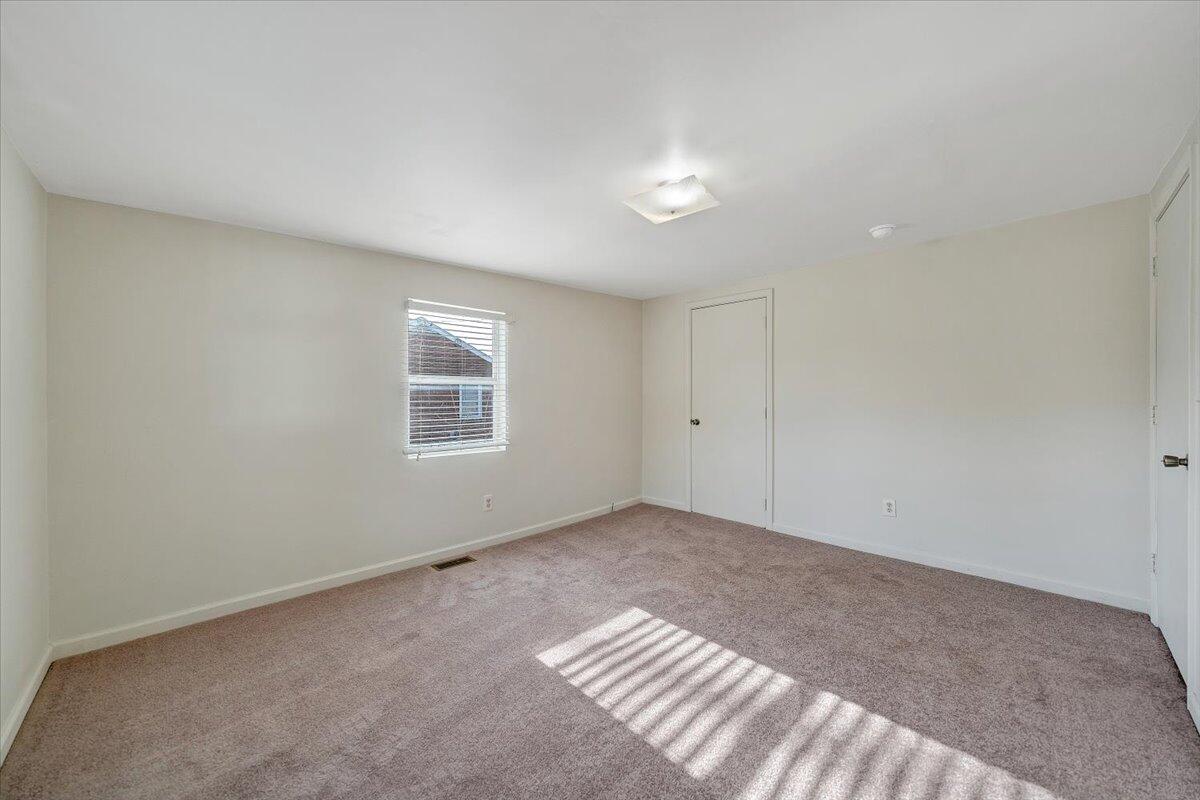 5549 Hollins Road Roanoke, VA 24019 - Photo 19 of 48 a view of an empty room with a window
