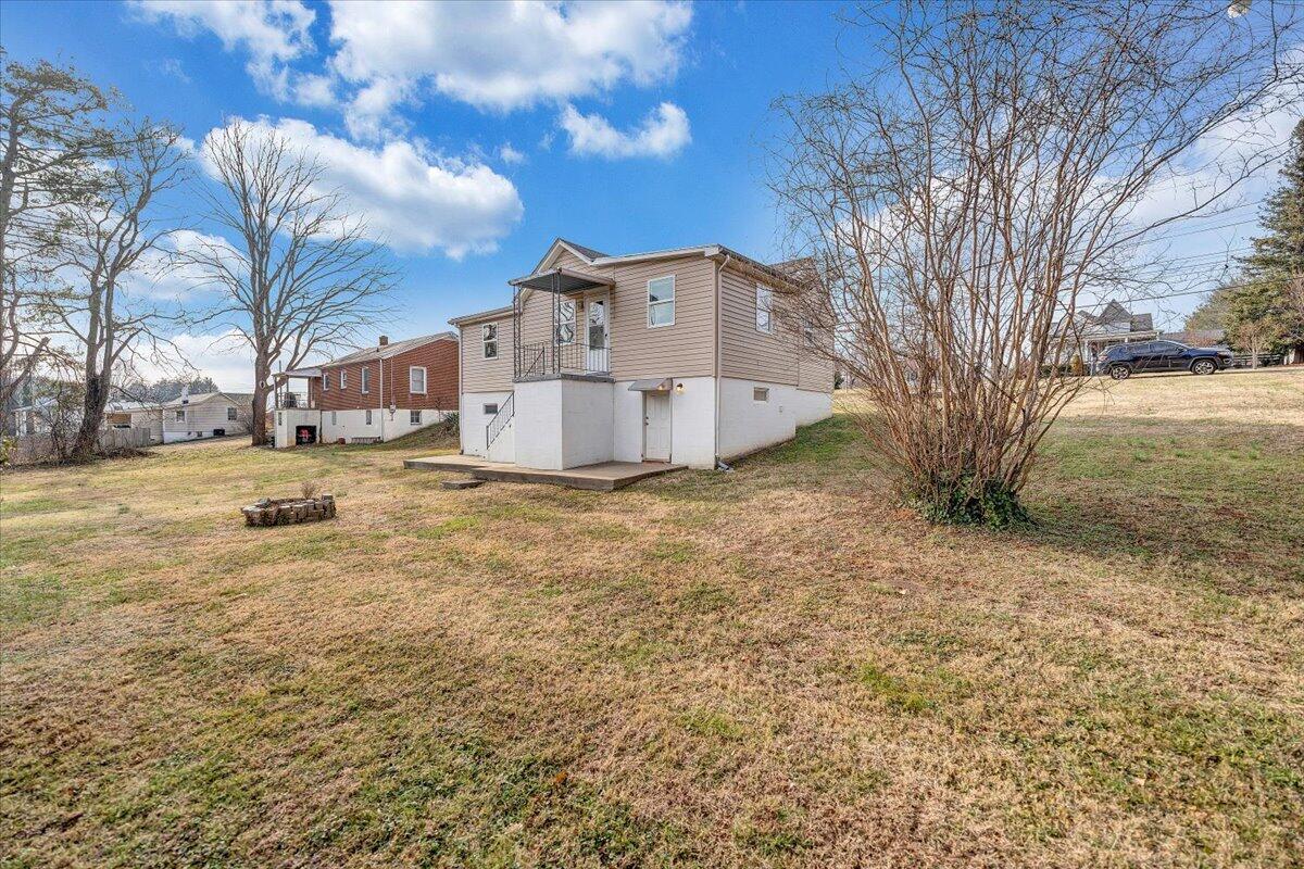 5549 Hollins Road Roanoke, VA 24019 - Photo 37 of 48 a view of a house with a yard