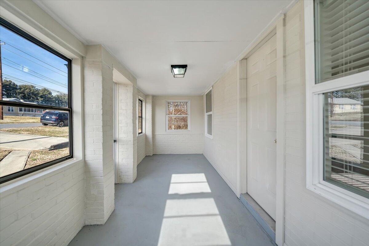5549 Hollins Road Roanoke, VA 24019 - Photo 6 of 48 a view of a hallway with windows