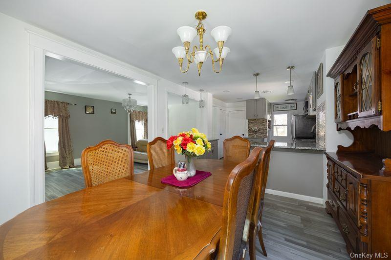 88 Innis Avenue Poughkeepsie, NY 12601 - Photo 10 of 25 a dining room filled chandelier and wooden floor