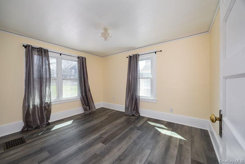88 Innis Avenue Poughkeepsie, NY 12601 - Photo 18 of 25 a view of empty room with wooden floor and fan
