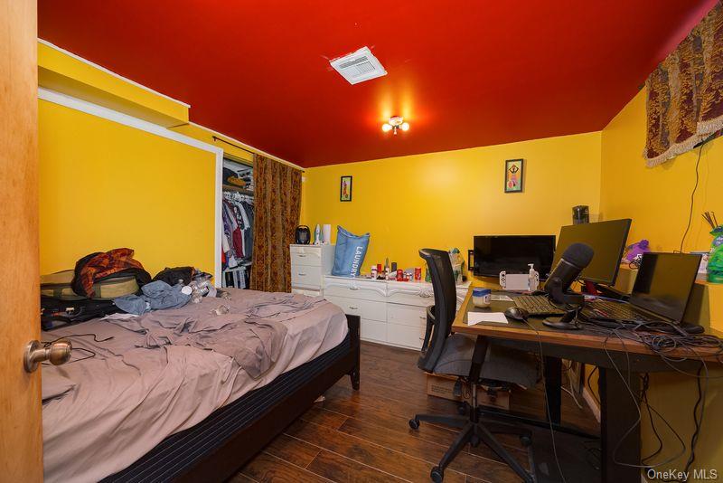 88 Innis Avenue Poughkeepsie, NY 12601 - Photo 24 of 25 a bedroom with a bed and a desk