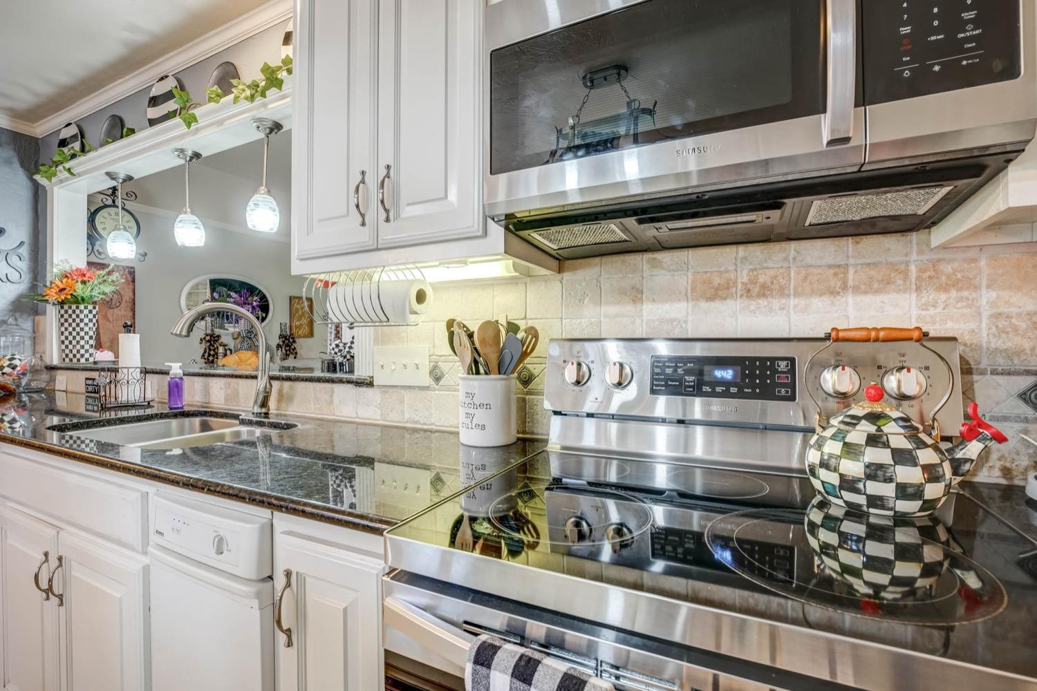 5229 91st Street Lubbock, TX 79424 - Photo 11 of 28 a kitchen with a stove and cabinets