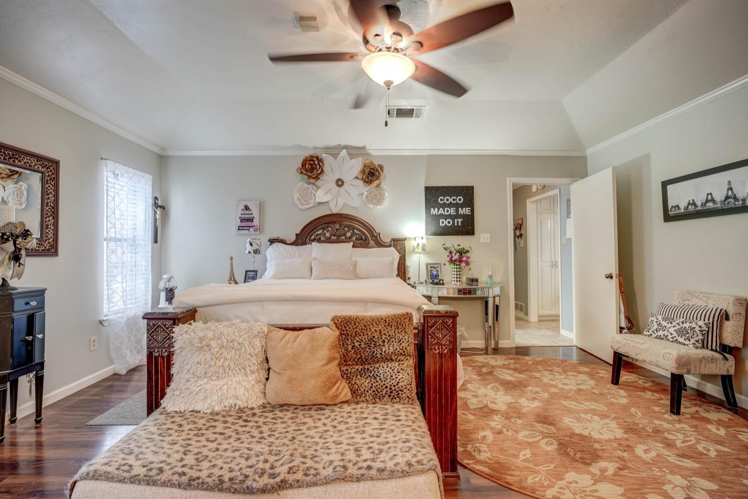 5229 91st Street Lubbock, TX 79424 - Photo 15 of 28 a bedroom with a bed and wooden floor