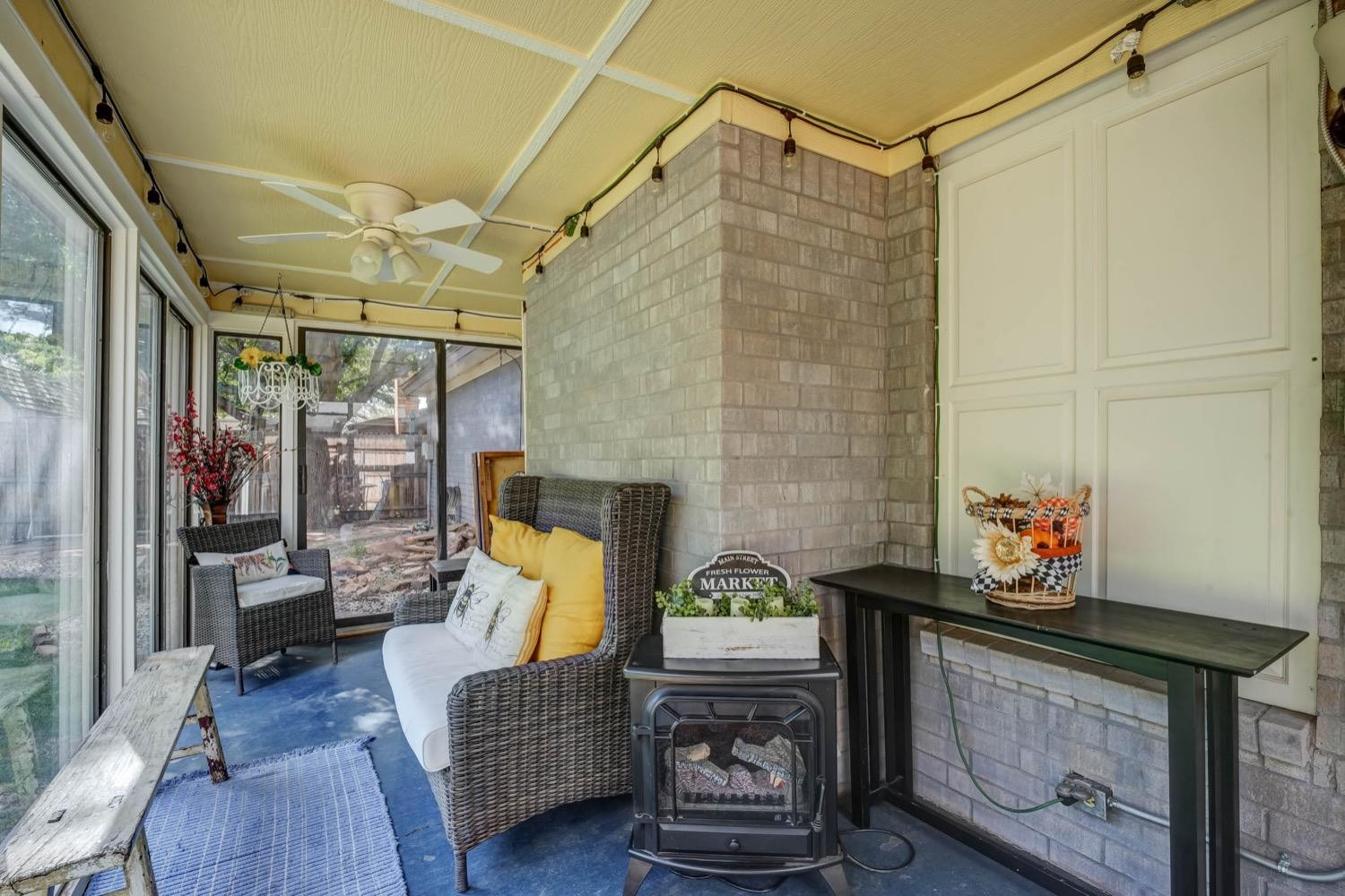 5229 91st Street Lubbock, TX 79424 - Photo 25 of 28 a living room filled with furniture and a fireplace