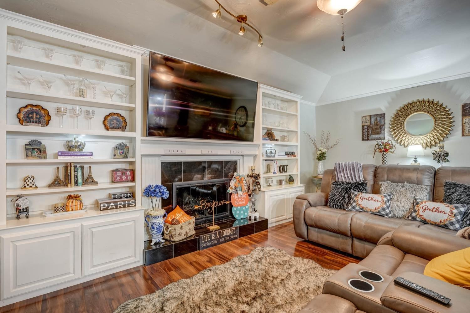 5229 91st Street Lubbock, TX 79424 - Photo 3 of 28 a living room with furniture and a fireplace