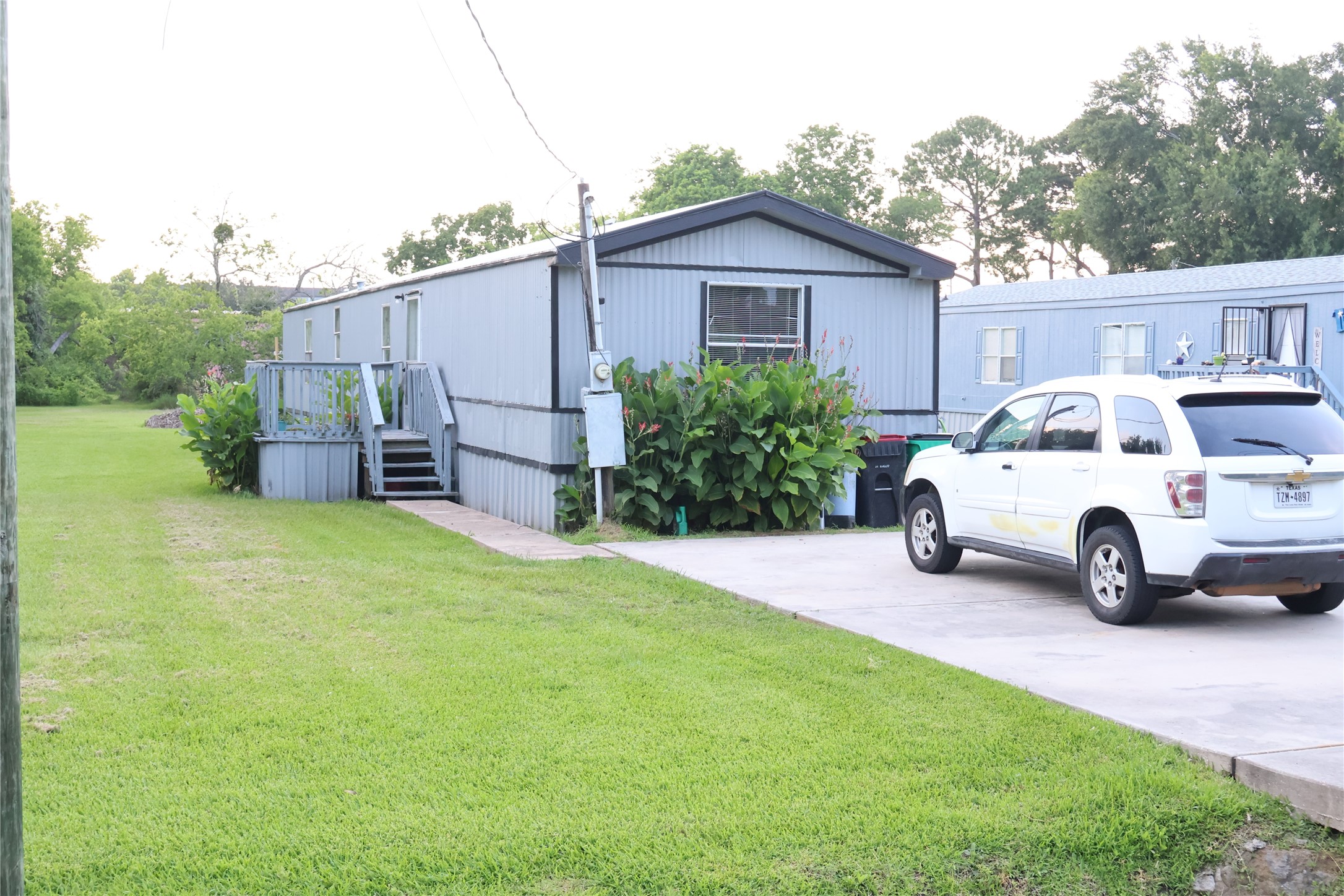108 Bob Smith Road Baytown, TX 77521 - Photo 8 of 10 106 Bob Smith Rd – Exterior view with dedicated parking and yard area.