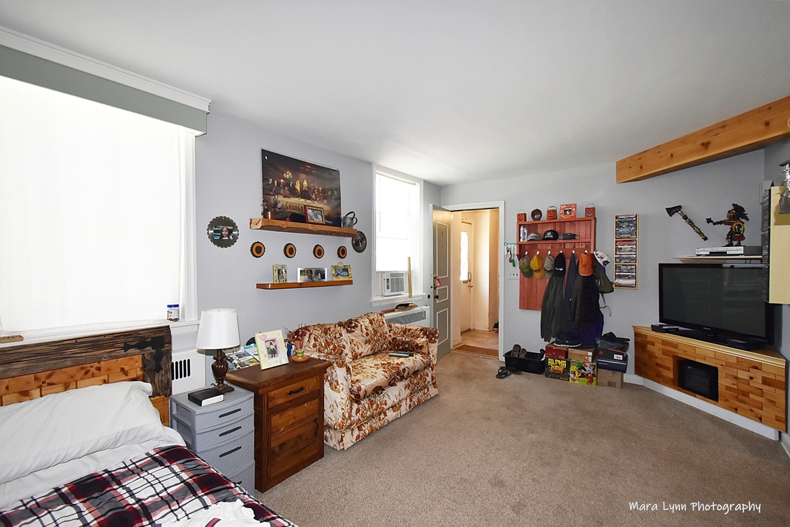 302 Division Street Geneva, IL 60134 - Photo 6 of 25 a bedroom with furniture and a flat screen tv