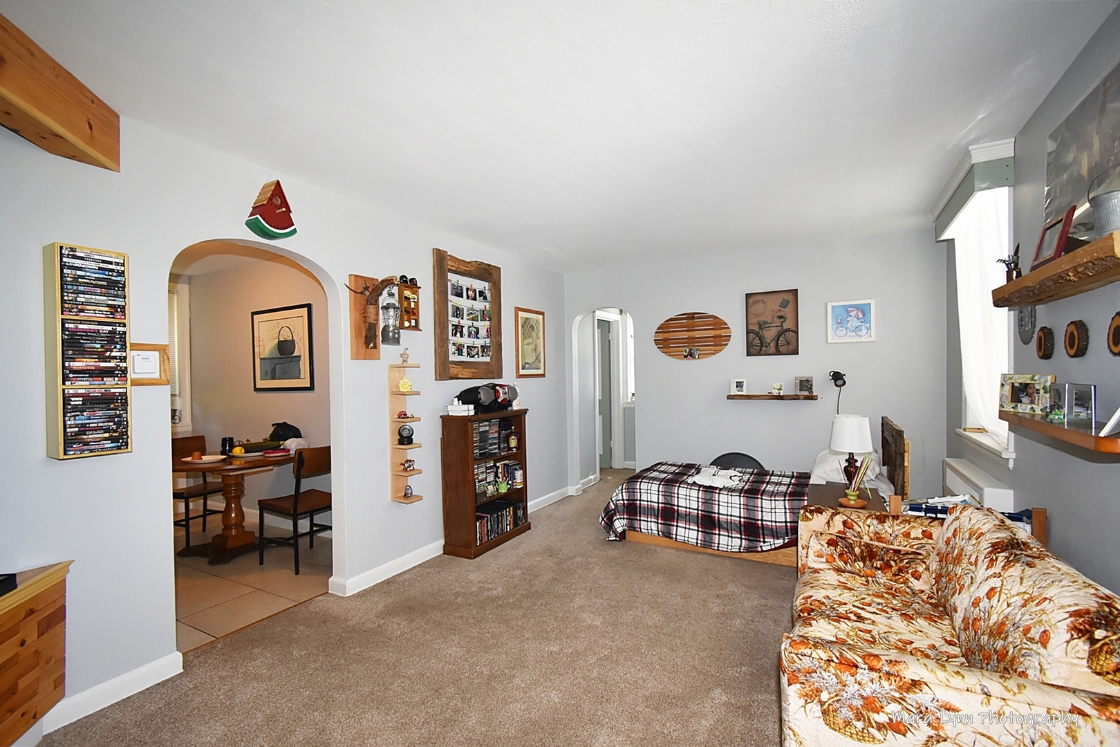 302 Division Street Geneva, IL 60134 - Photo 7 of 25 a bedroom with furniture and a large window