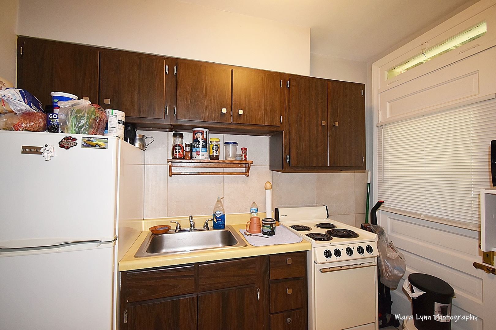 302 Division Street Geneva, IL 60134 - Photo 9 of 25 a kitchen with a sink a stove and cabinets