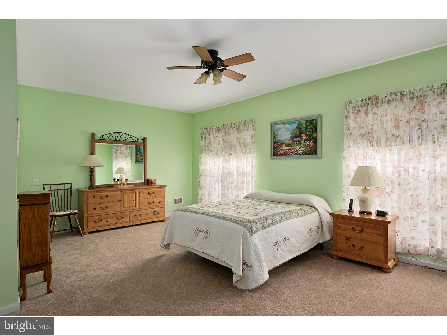 30 Emery Way Delanco, NJ 08075 - Photo 18 of 25 a bedroom with a bed and a chandelier
