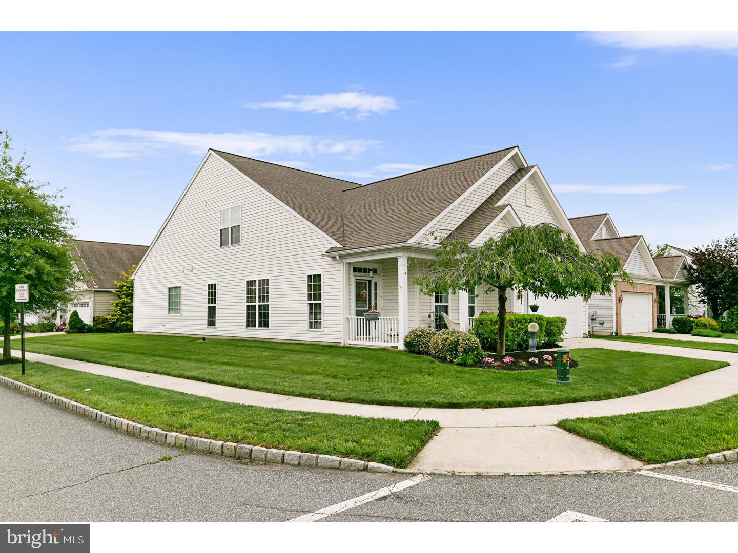 30 Emery Way Delanco, NJ 08075 - Photo 2 of 25 a view of a white house next to a yard with big trees