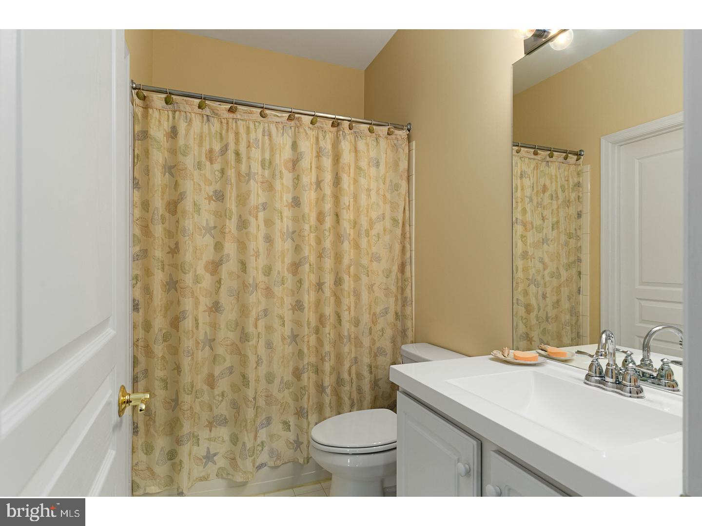 30 Emery Way Delanco, NJ 08075 - Photo 9 of 25 a bathroom with a sink a toilet and shower curtain