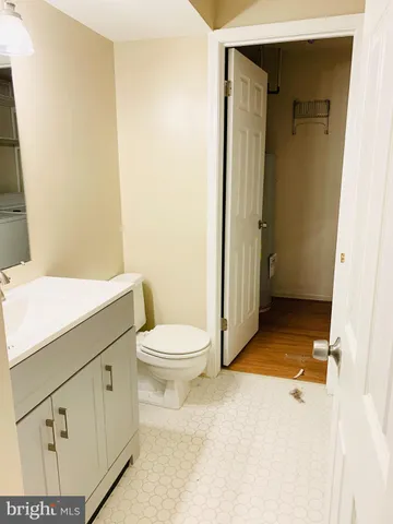 a bathroom with a toilet a sink and shower