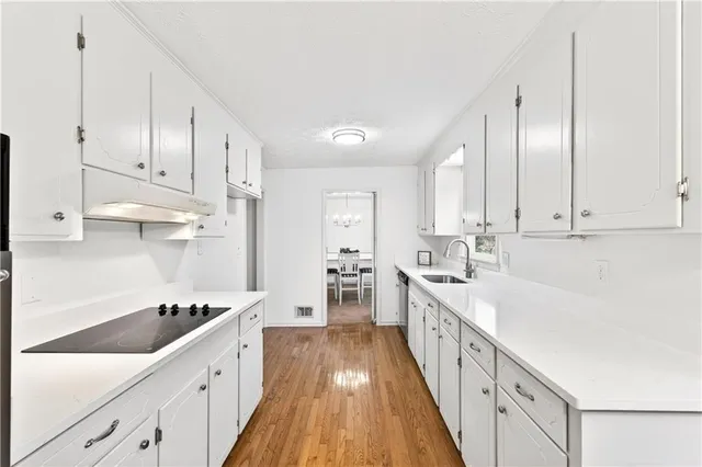 a bathroom with a sink toilet and a mirror