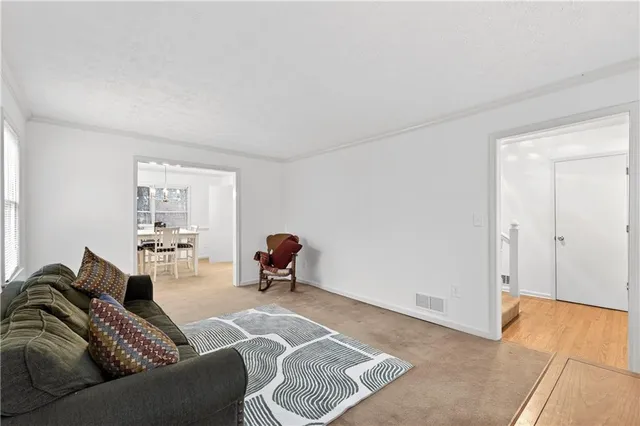 a view of a dining room with furniture and window