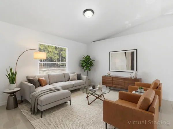 a living room with furniture and a window