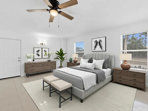 a bedroom with a bed and a couch