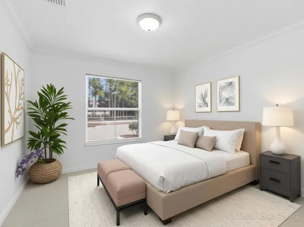 a bedroom with bed and a window