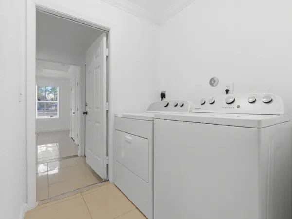 a utility room with dryer and washer
