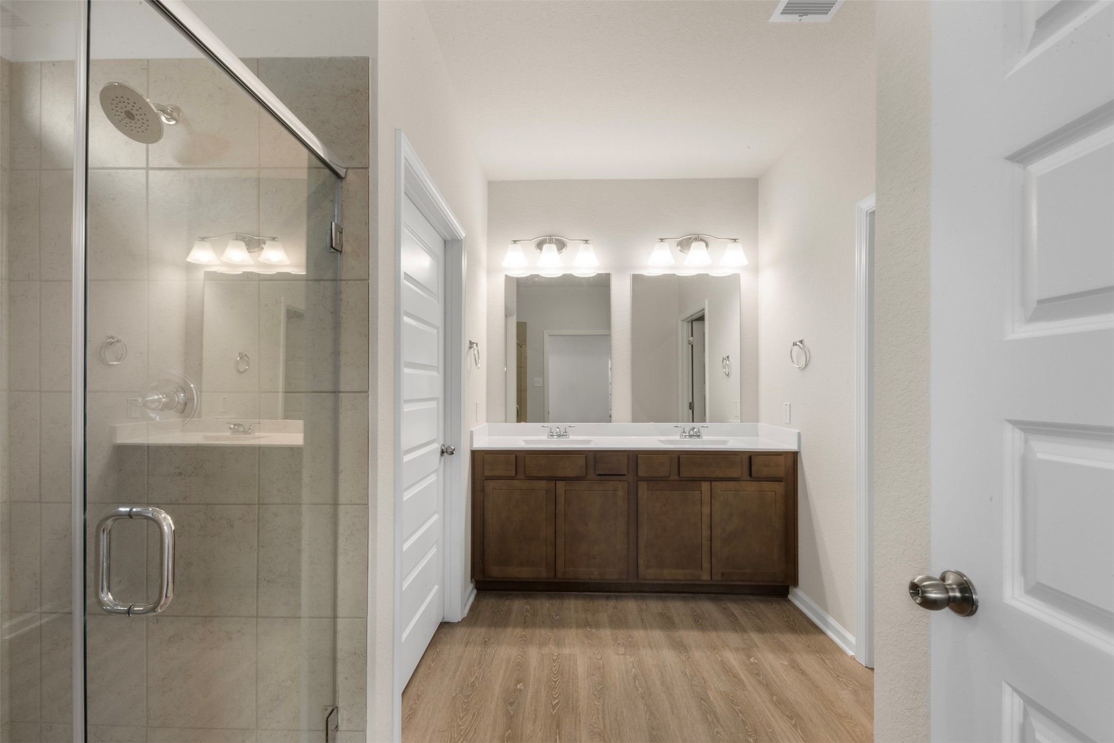 10249 Badger Run Lane Magnolia, TX 77354 - Photo 18 of 36 a bathroom with a double vanity sink and mirror