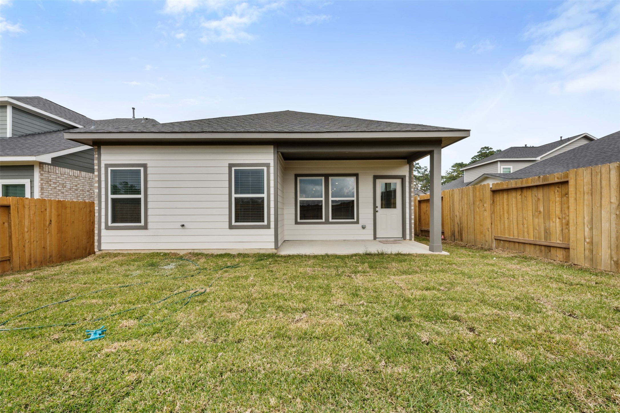 10249 Badger Run Lane Magnolia, TX 77354 - Photo 27 of 36 a house that has a big yard in front of it