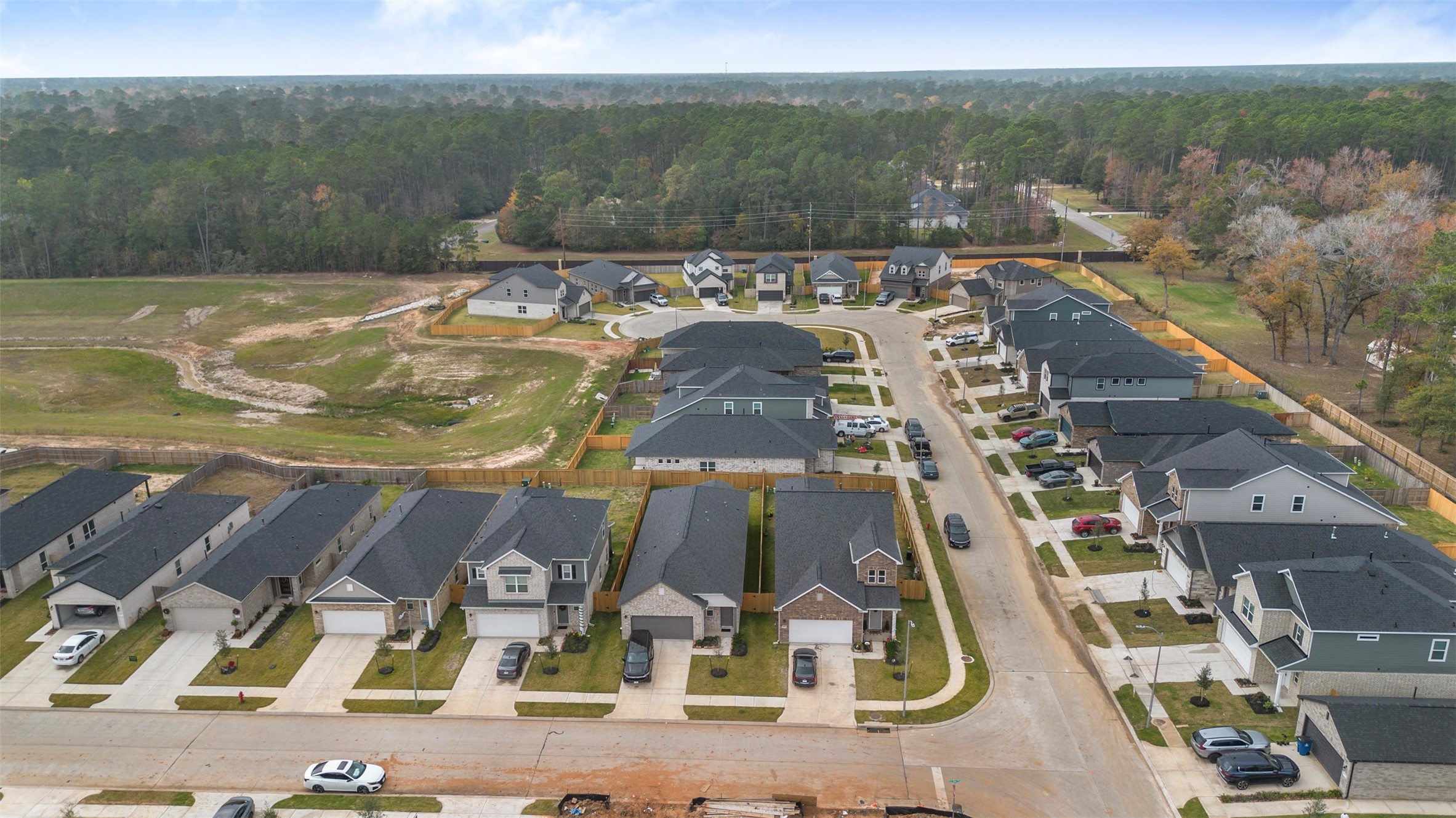 10249 Badger Run Lane Magnolia, TX 77354 - Photo 34 of 36 an aerial view of residential houses with outdoor space