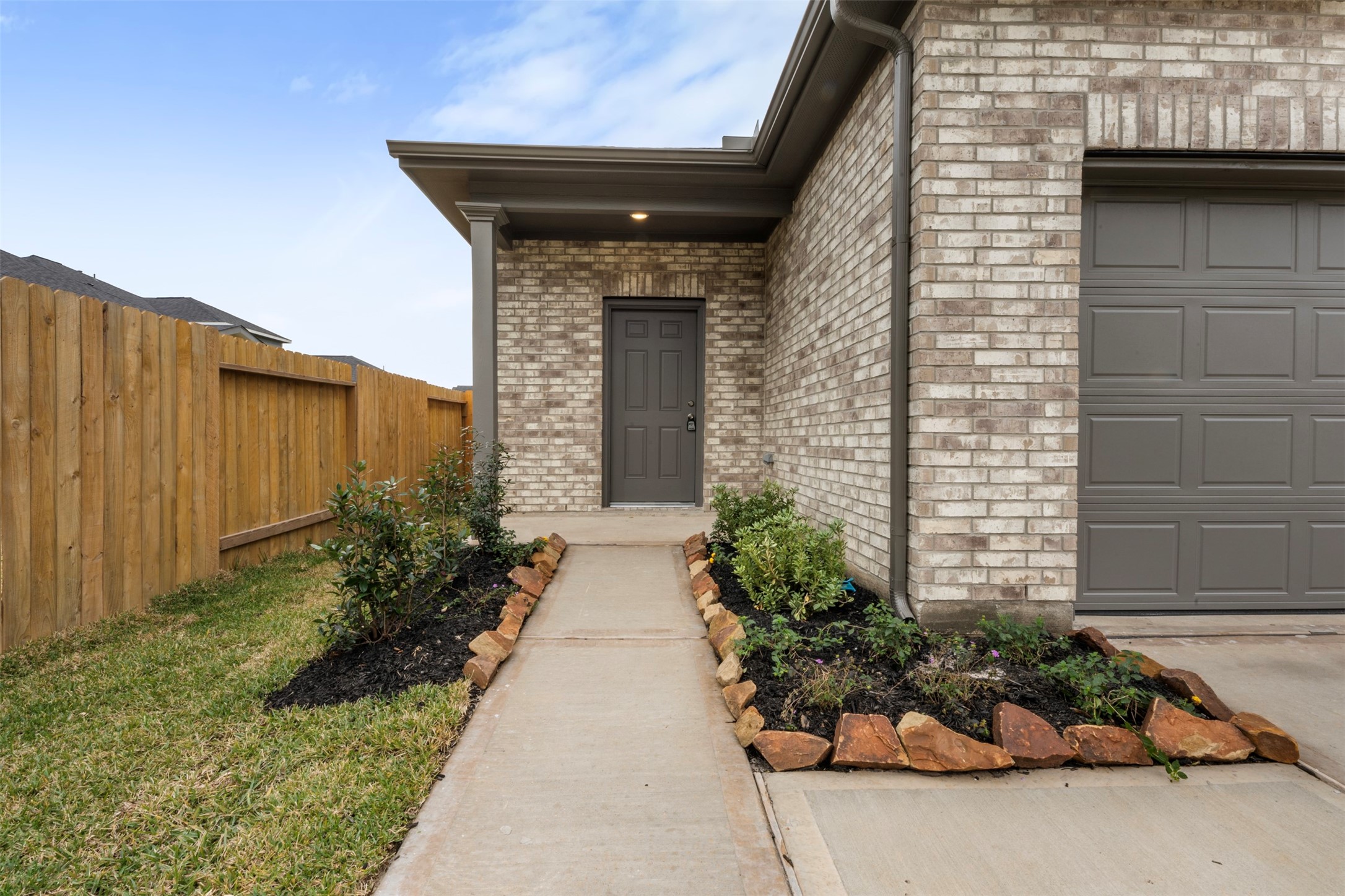 10249 Badger Run Lane Magnolia, TX 77354 - Photo 4 of 36 a front view of a house with a yard