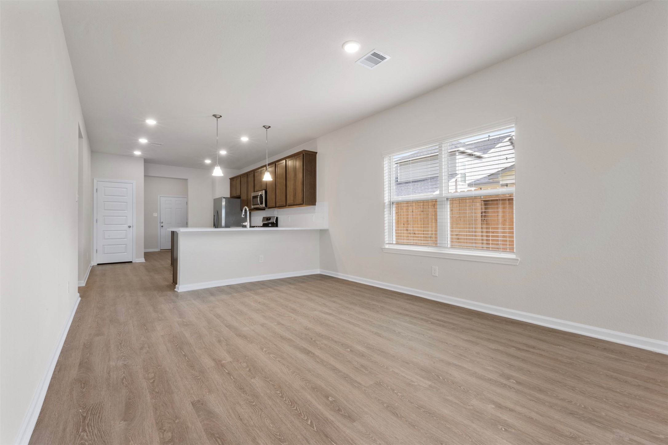 10249 Badger Run Lane Magnolia, TX 77354 - Photo 10 of 36 a view of kitchen with microwave oven and cabinets